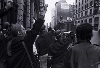 Hundreds of draft protestors stand outside the courthouse where the trial of the Catonsville Nine takes place, peace signs up in support of the Nine. (Source: William Morgenstern, [War and draft protest], 1968. Gelatin silver print. University Archives, University of Maryland, Baltimore County, UARC Photos-09-01-0025.)