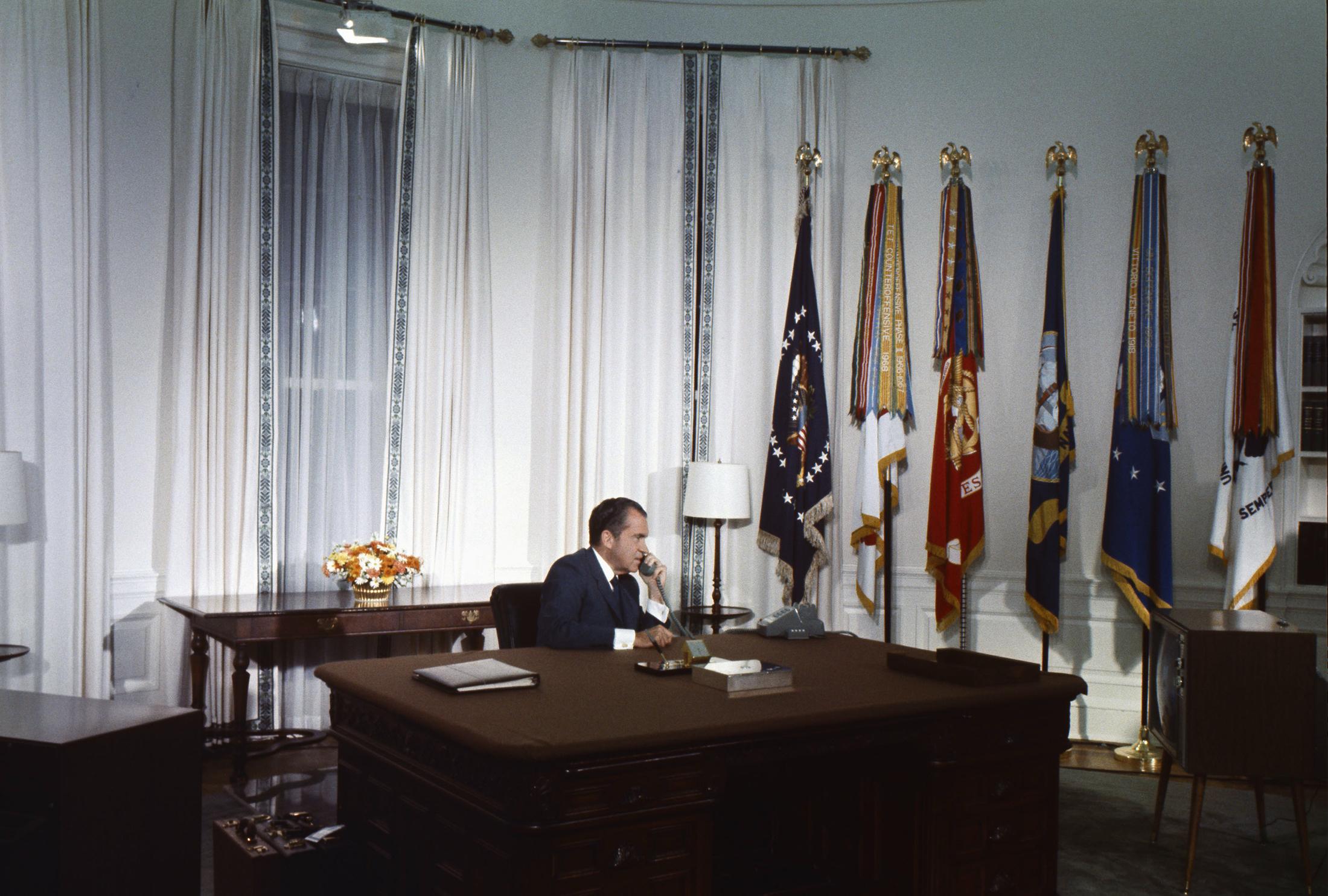 “President Nixon in the Oval Office speaking on the telephone to the Apollo XI astronauts Neil Armstrong and Edwin “Buzz” Aldrin while they were on the Moon, July 20, 1969.” (Photo Source: Richard Nixon Presidential Library and Museum Website (National Archives) http://www-archives-gov-s.njmu.s5.bt8.net/presidential-libraries/events/centennials/nixon/exhibit/nixon-online-exhibit-calls.html “President Nixon in the Oval Office speaking on the telephone to the Apollo XI astronauts Neil Armstrong and Edwin “Buzz” Aldrin while they were on the Moon, July 20, 1969.” (Photo Source: Richard Nixon Presidential Library and Museum Website (National Archives) http://www-archives-gov-s.njmu.s5.bt8.net/presidential-libraries/events/centennials/nixon/exhibit/nixon-online-exhibit-calls.html